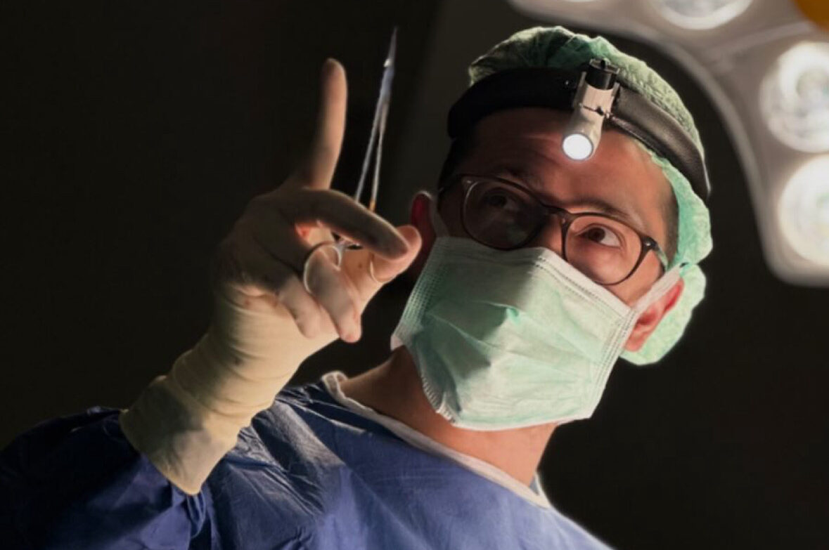Op. Dr. Erdal Erkoç in the operating room wearing a surgical headlight